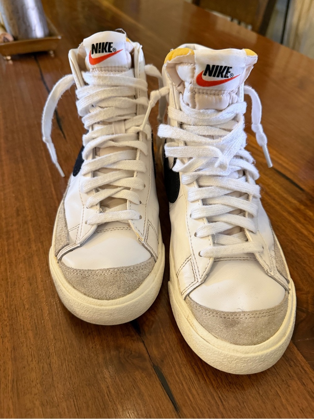 Nike White High-Top Sneakers with Black Swoosh